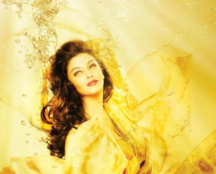 In another photo, a teaser campaign with the theme Bathe in Gold, she is seen in bright yellow hues that merge with the golden water background around her/Kalyan Jewellers/Facebook