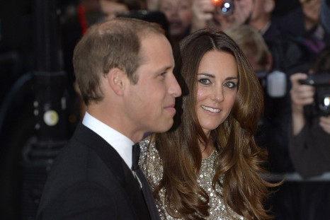 Eyes only for her prince! Kate Middleton looks at Prince William at a charity event on 1 September, 2013. A royal biographer has revealed that William and Kate knew each other long before their days at St. Andrews university. (Photo: REUTERS)
