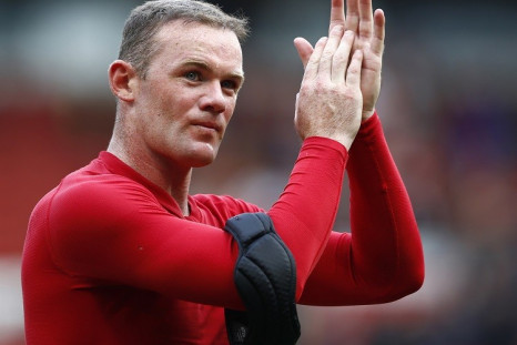 Manchester United's Wayne Rooney applauding. Man U's manager David Moyes and bumper financial results makes football club increase fiscal outlook for 2014 (photo: reuters)