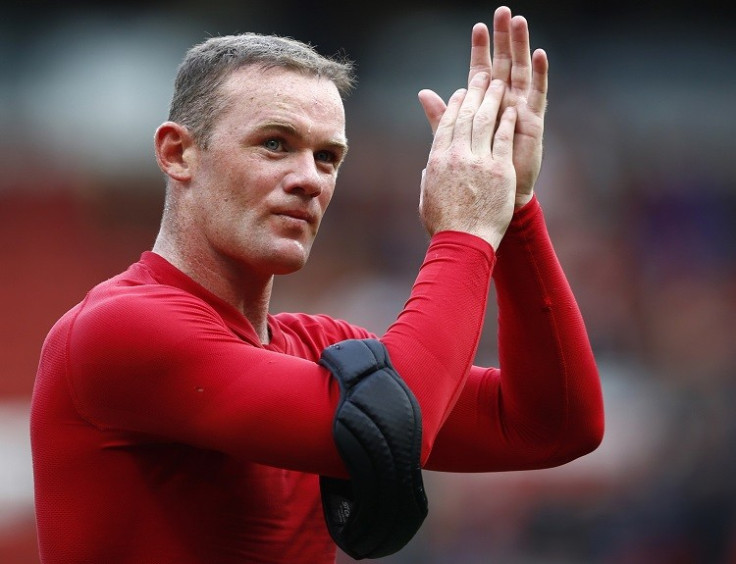 Manchester United's Wayne Rooney applauding. Man U's manager David Moyes and bumper financial results makes football club increase fiscal outlook for 2014 (photo: reuters)