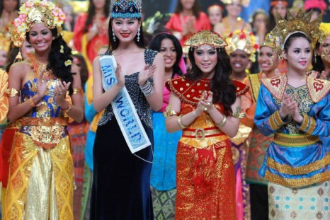 Miss World 2013 contestants pose with Miss World 2012 during the opening ceremony of the pageant in Bali, on 8 September. Earlier scheduled to take place in Jakarta, the Miss World final will also happen in Bali. (Photo: Miss World/Facebook)