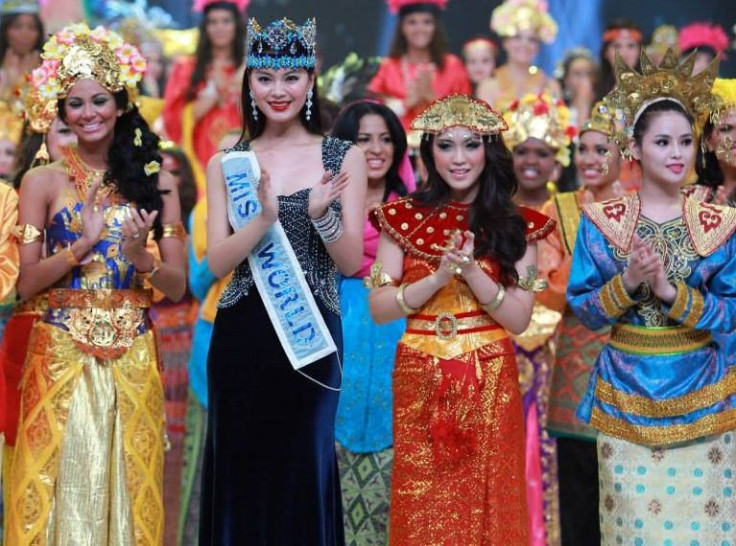 Miss World 2013 contestants pose with Miss World 2012 during the opening ceremony of the pageant in Bali, on 8 September. Earlier scheduled to take place in Jakarta, the Miss World final will also happen in Bali. (Photo: Miss World/Facebook)