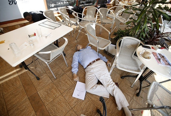 The gunmen wore white bandanas and appeared to work in teams, each team taking control of a different floor of the five-storey mall/Reuters