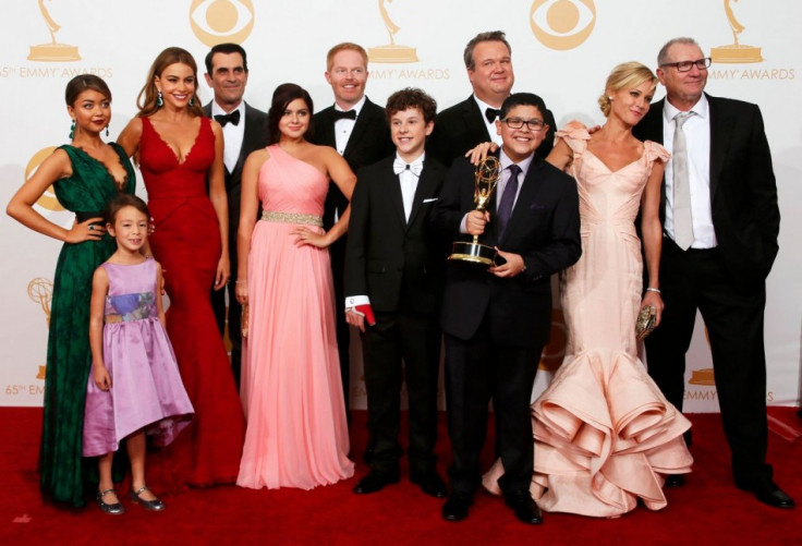 The cast of ABC's series Modern Family poses with their award for Outstanding Comedy Series at the 65th Primetime Emmy Awards in Los Angeles. (Reuters)