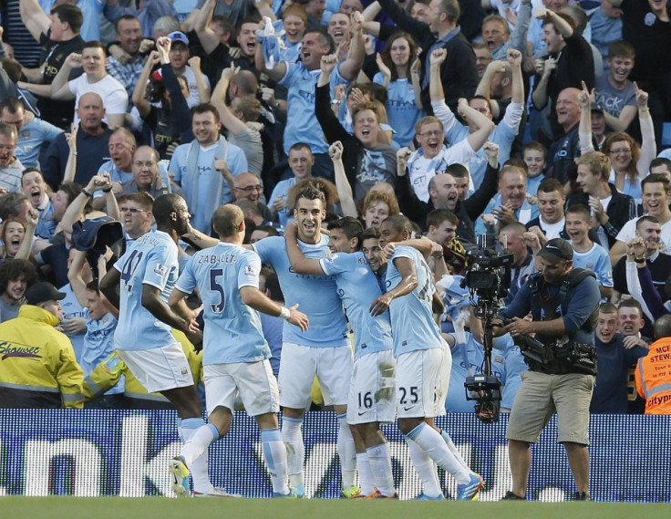 Manchester City Players Celebrate After Scoring