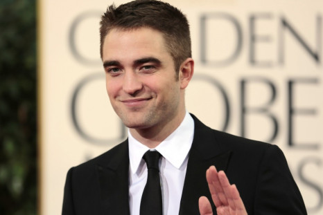 Robert Pattinson Debuts New Brunette Girlfriend/Reuters