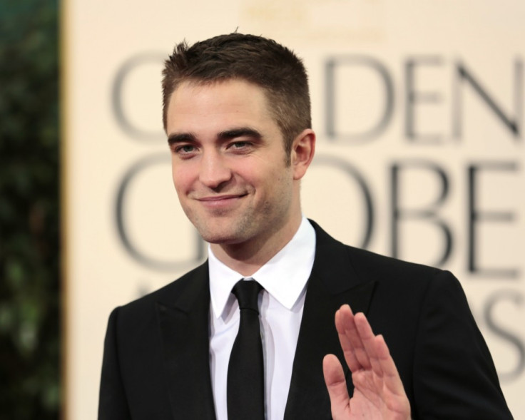 Robert Pattinson Debuts New Brunette Girlfriend/Reuters