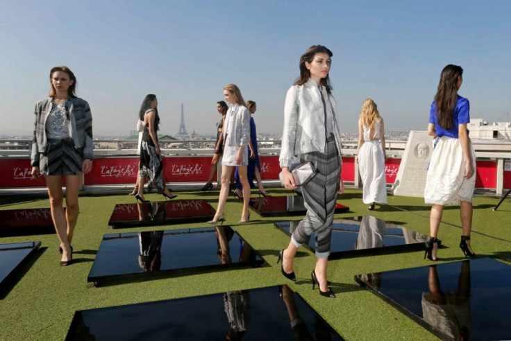 Models present creations by French designer Christine Phung as part of her Spring/Summer 2014 women's ready-to-wear fashion show. (Photo: REUTERS/Benoit Tessier)