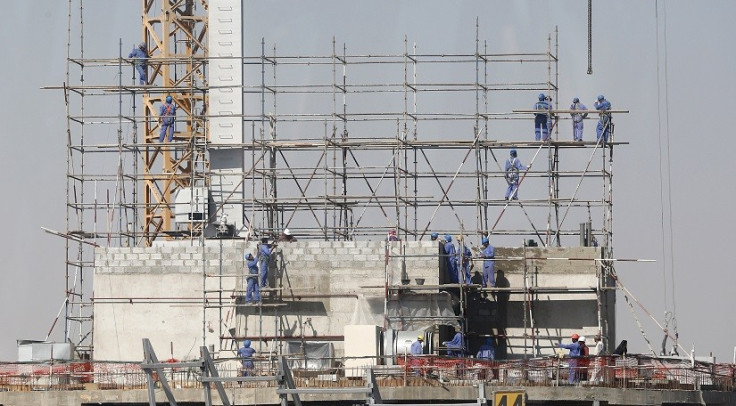 Labourers toil on construction site in searing heat and not all are paid, it was alleged PIC: Reuters