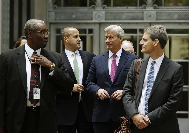 JPM CEO Jamie Dimon (2nd R) leaves the US Justice Department after meeting with Attorney General Eric Holder, in Washington September 26, 2013 over a possible $11bn settlement to end mortgage probes (Photo: Reuters)