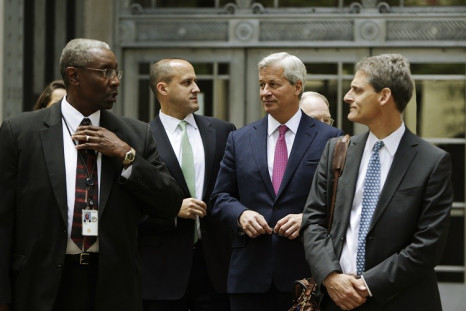 JPM CEO Jamie Dimon (2nd R) leaves the US Justice Department after meeting with Attorney General Eric Holder, in Washington September 26, 2013 over a possible $11bn settlement to end mortgage probes (Photo: Reuters)