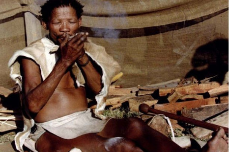 Bushman Petrus Kruiper, 76, dressed in animal skins, smokes as he is exhibited like a zoo animal at the annual fair in this town about 110 km west of Johannesburg. A tribal people's organisation has urged holidaymakers to boycott Botswana for the ill trea