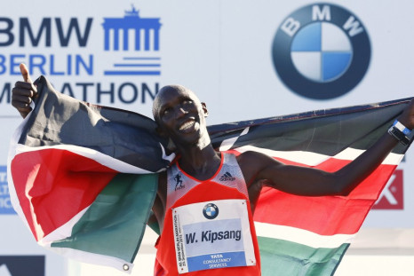 Wilson Kipsang of Kenya celebrates with the Kenyan national flag after winning in the 40th Berlin marathon.