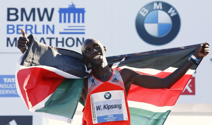 Wilson Kipsang of Kenya celebrates with the Kenyan national flag after winning in the 40th Berlin marathon.