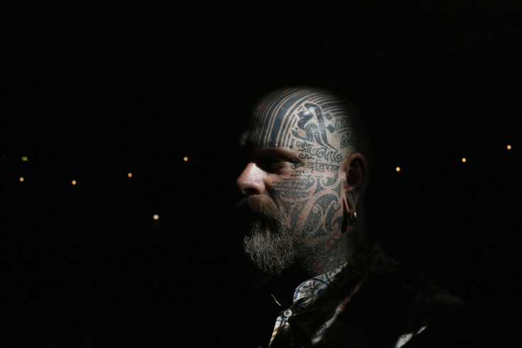 Tattoo artist Matt Black displays tattoos on his head.