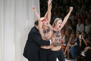 Topless Femen activists storm Nina Ricci catwalk at Paris fashion week