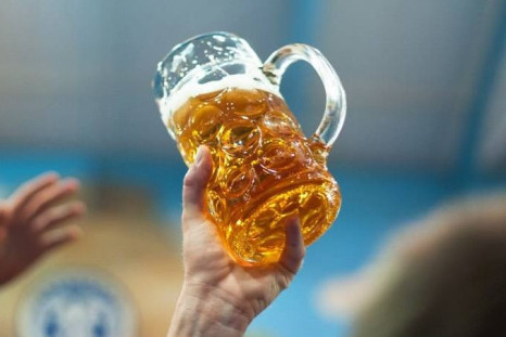 A visitor raises a toast with a beer mug at the 180th Oktoberfest in Munich, Germany. (Photo: Oktoberfest.de/Facebook)