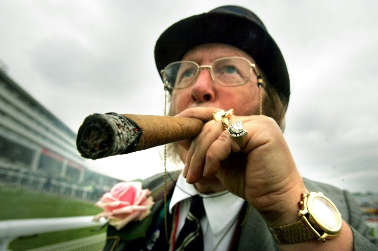 John McCririck was famous for his signature flamboyant style on Channel 4 PIC: Reuters