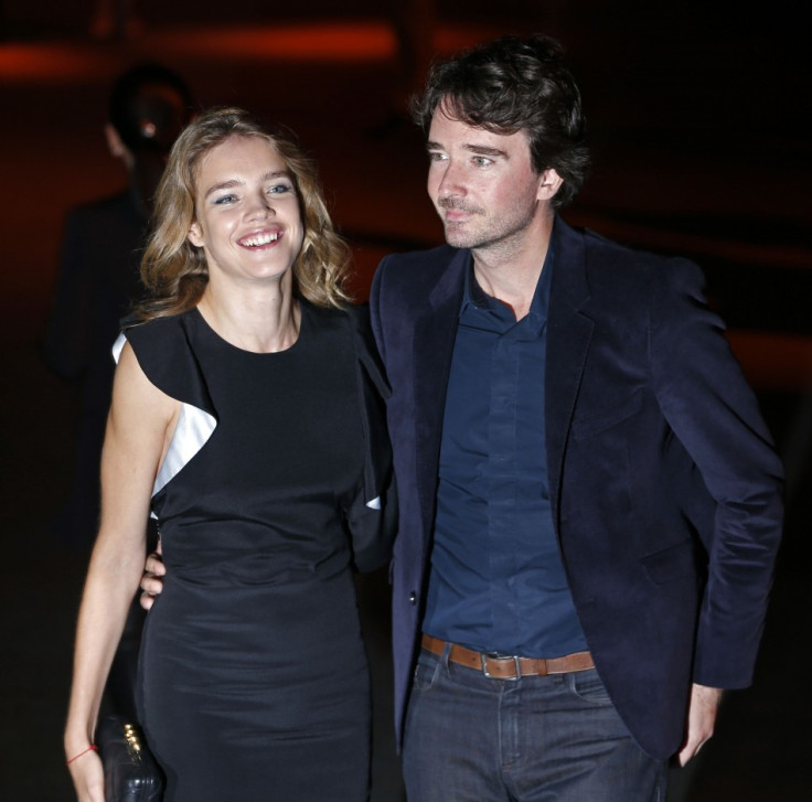 Antoine Arnault (R), member of LVMH group's board of directors and head of communications for Louis Vuitton, and girlfriend, Russian model Natalia Vodianova arrive at the Givenchy Spring/Summer 2014 women's ready-to-wear fashion show during Paris Fashion