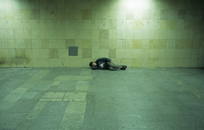 A homeless man sleeps on a platform in Budapest PIC: Reuters