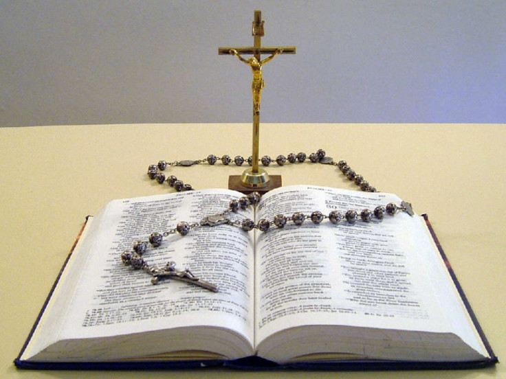 Samples of Catholic religious objects—The Holy Bible, a Crucifix, and a Rosary. (Wikimedia)