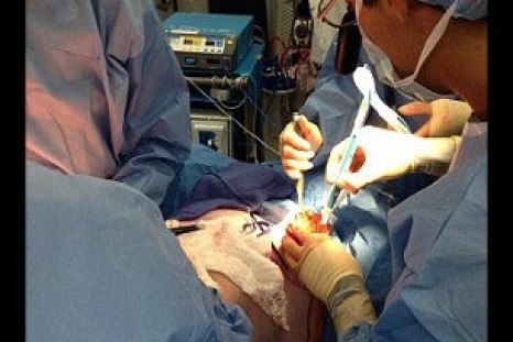Melissa Ray: Mother, 39, with same cancer gene as Angelina Jolie allows her double mastectomy surgery to be live-tweeted to help inform women considering the same