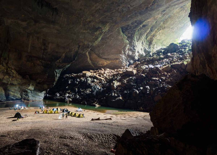 Adventure travellers camp near the river inside Vietnam's Son Doong Cave. (Photo: Oxalis)