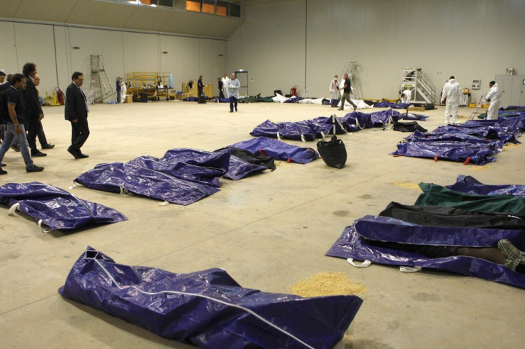 Body bags containing African migrants, who drowned trying to reach Italian shores, lie in a hangar of the Lampedusa airport
