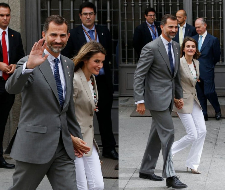 Princess Letizia and her husband, Spain's Crown Prince Felipe, walk away after she collected money donations for the Spanish Red Cross during "Fiesta de la Banderita" in Madrid. (Photo: REUTERS/Susana Vera)