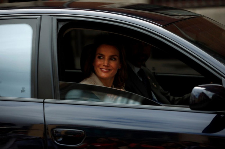 Princess Letizia smiles as she leaves after collecting money donations. (Photo: REUTERS/Susana Vera)