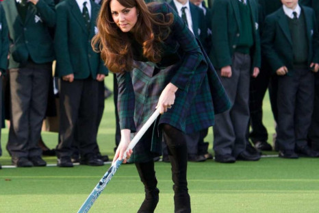 Kate Middleton joins children for a game of hockey during a visit to her old school in Pangbourne, Berkshire, in November 2012. (Photo: Clarence House)
