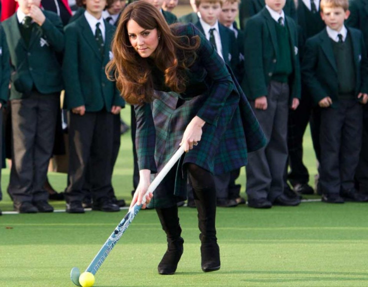 Kate Middleton joins children for a game of hockey during a visit to her old school in Pangbourne, Berkshire, in November 2012. (Photo: Clarence House)