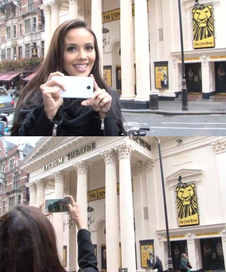 Megan Young takes a picture of Lyceum Theatre, where the first Miss World pageant took place in 1951. (Photo: YouTube Video Screenshot/Miss World Organisation)