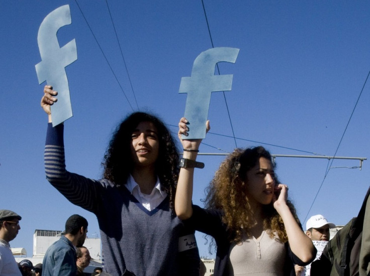 Protesters hold up 'f's in acknowleddemement of Facebook's role in political revolts in North Africa in Rabat, Morocco.