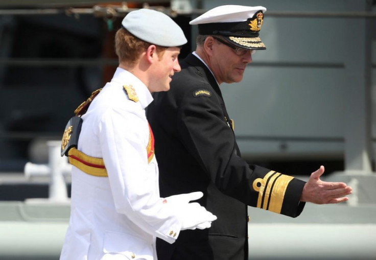Prince Harry walks with Rear Admiral Ray Griggs before saluting te troops at Garden Island during International Fleet Review in Sydney. (Photo: REUTERS)