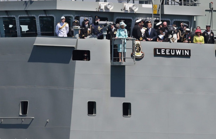 Prince Harry and Australia's Governor-General Quentin Bryce salute the troops on Sydney Harbour from aboard the HMAS Leeuwin. (Photo: REUTERS)
