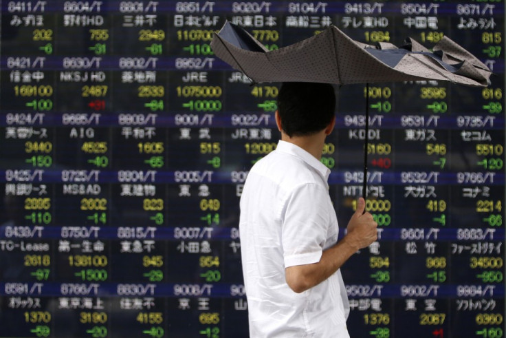 Asian markets reverse early gains and trade lower on 7 October