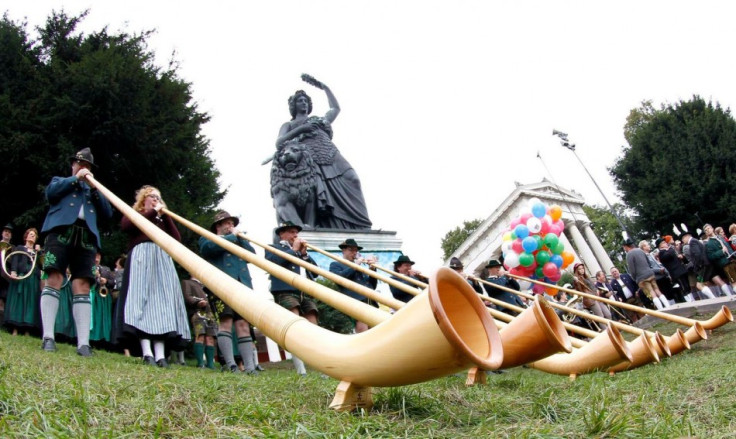 Brass band in traditional Bavarian clothes play instruments during Oktoberfest beer festival. (Photo: Reuters)