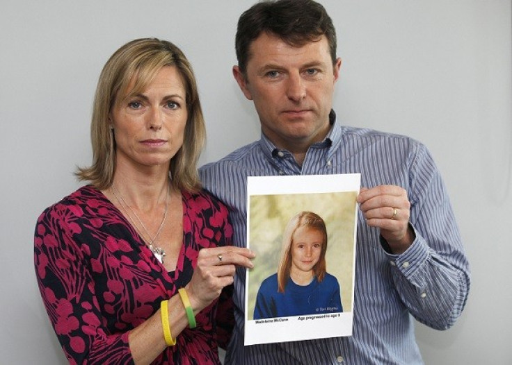 Kate and Gerry McCann pose with a computer generated image of how their missing daughter Madeleine might look now (Reuters)