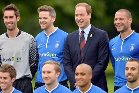 Prince William with footballers of Polytechnic FC PIC: Reuters