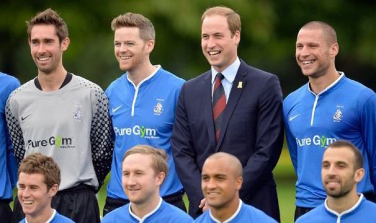 Prince William with footballers of Polytechnic FC PIC: Reuters