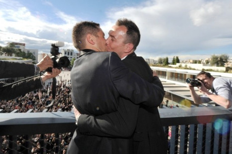 Vincent Autin and Bruno Boileau, who are the first homosexual couple to legally marry in France, kiss at Tel Aviv Gay Parade. A new study reveals that homosexuality was not a taboo in ancient societies. (Photo: Reuters)