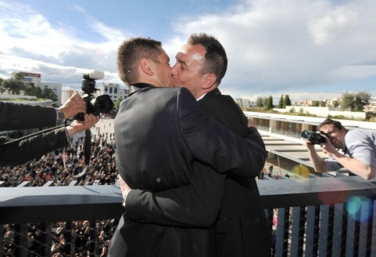 Vincent Autin and Bruno Boileau, who are the first homosexual couple to legally marry in France, kiss at Tel Aviv Gay Parade. A new study reveals that homosexuality was not a taboo in ancient societies. (Photo: Reuters)