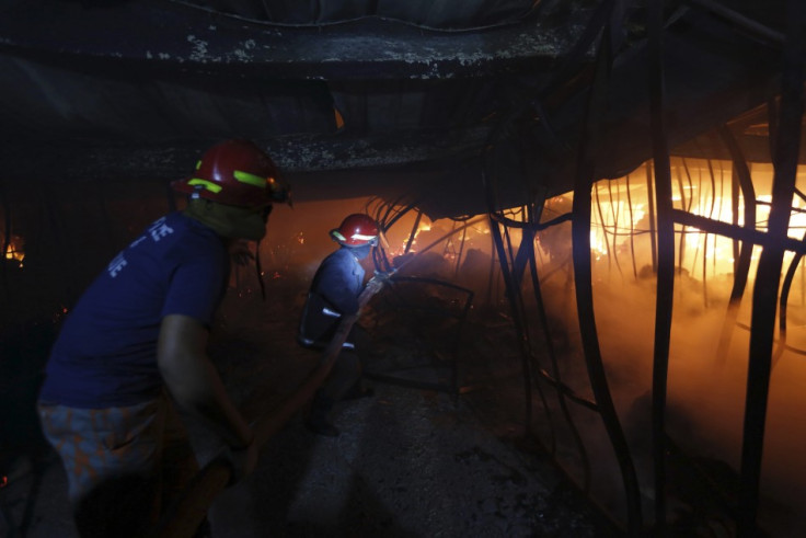 Firefighters try to control a fire inside a garment factory in the Bangladeshi town of Gazipur