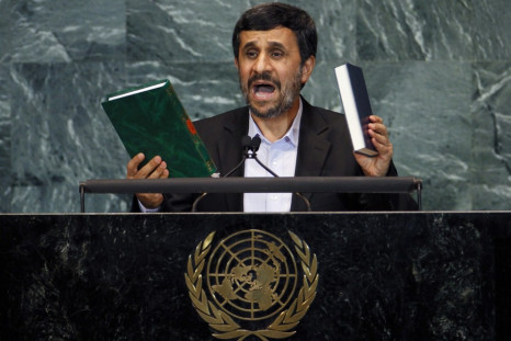 Iran's President Mahmoud Ahmadinejad holds up copies of the Koran (L) and the Bible as he addresses the 65th United Nations General Assembly at the U.N. headquarters in New York, September 23, 2010