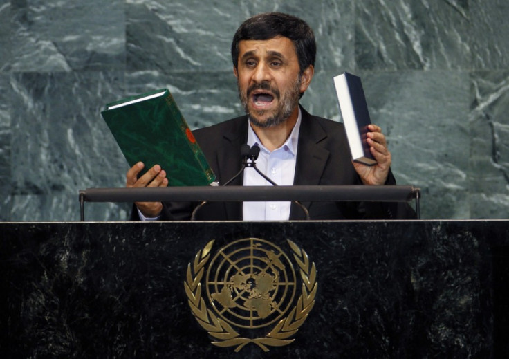 Iran's President Mahmoud Ahmadinejad holds up copies of the Koran (L) and the Bible as he addresses the 65th United Nations General Assembly at the U.N. headquarters in New York, September 23, 2010