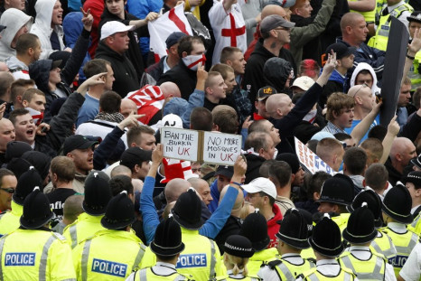 Police officers keep EDL marchers away from a rival UAF protest in Bradford in 2010 PIC: Reuters