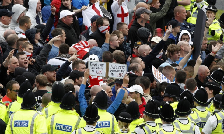 Police officers keep EDL marchers away from a rival UAF protest in Bradford in 2010 PIC: Reuters