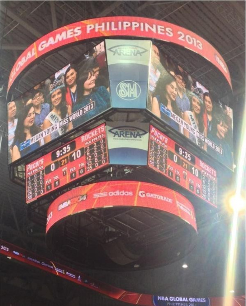 Megan Young is seen at the big screen at NBA game, where she made the ceremonial toss. (Photo: Miss World organisation)