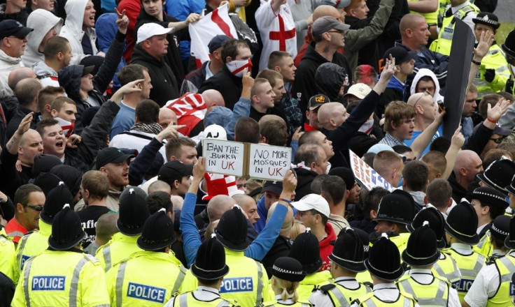 Police officers keep EDL marchers away from a rival UAF protest in Bradford in 2010 (Reuters)